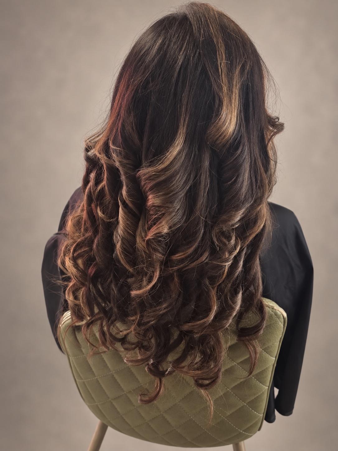 Dimensional curls photographed from behind